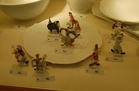  A group of porcelain clowns.  I purchased the tuba player to the lower left for Mom!