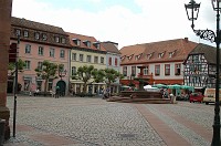  The market square with a fountain in the middle.