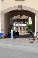  Carolyn in front of an arch leading into the Old Town area.