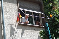  A couple watches the crowd go by.